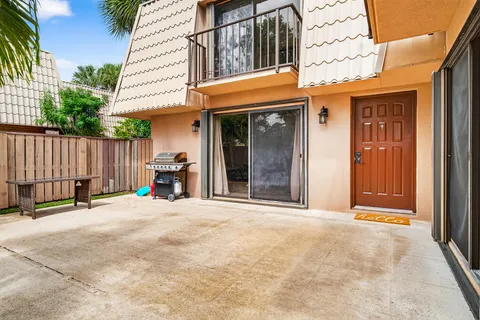 a view of a building with door and outdoor space