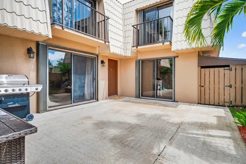 a view of a building with a sink and a yard