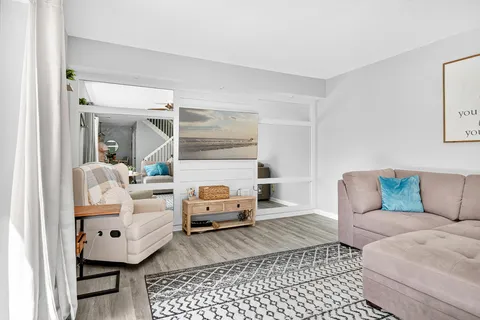 a living room with furniture and a rug