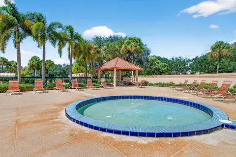 a view of a swimming pool with an outdoor space and seating area
