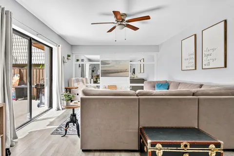 a living room with furniture and a window