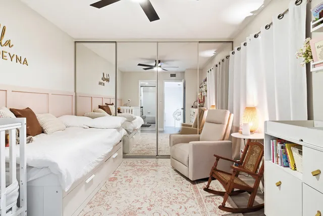 a view of an outdoor sitting area with wooden fence