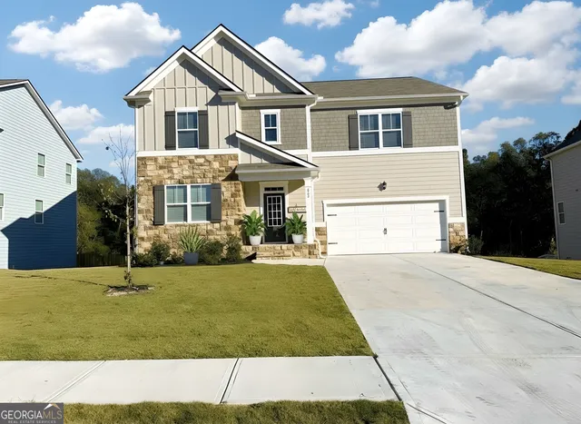 a front view of a house with a yard