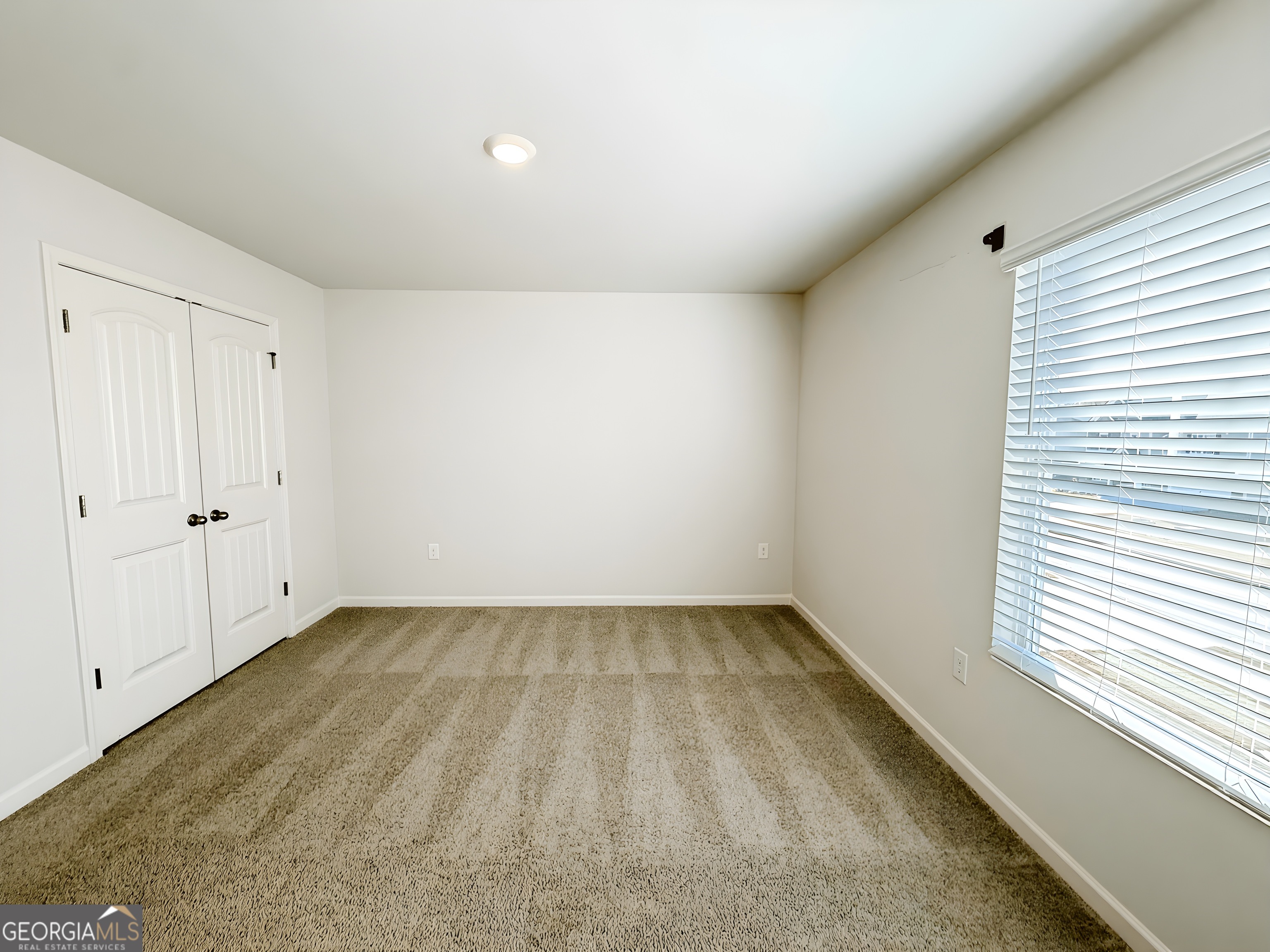 622 Brookfield Drive Braselton, GA 30517 - Photo 14 of 34 a view of an empty room with a window
