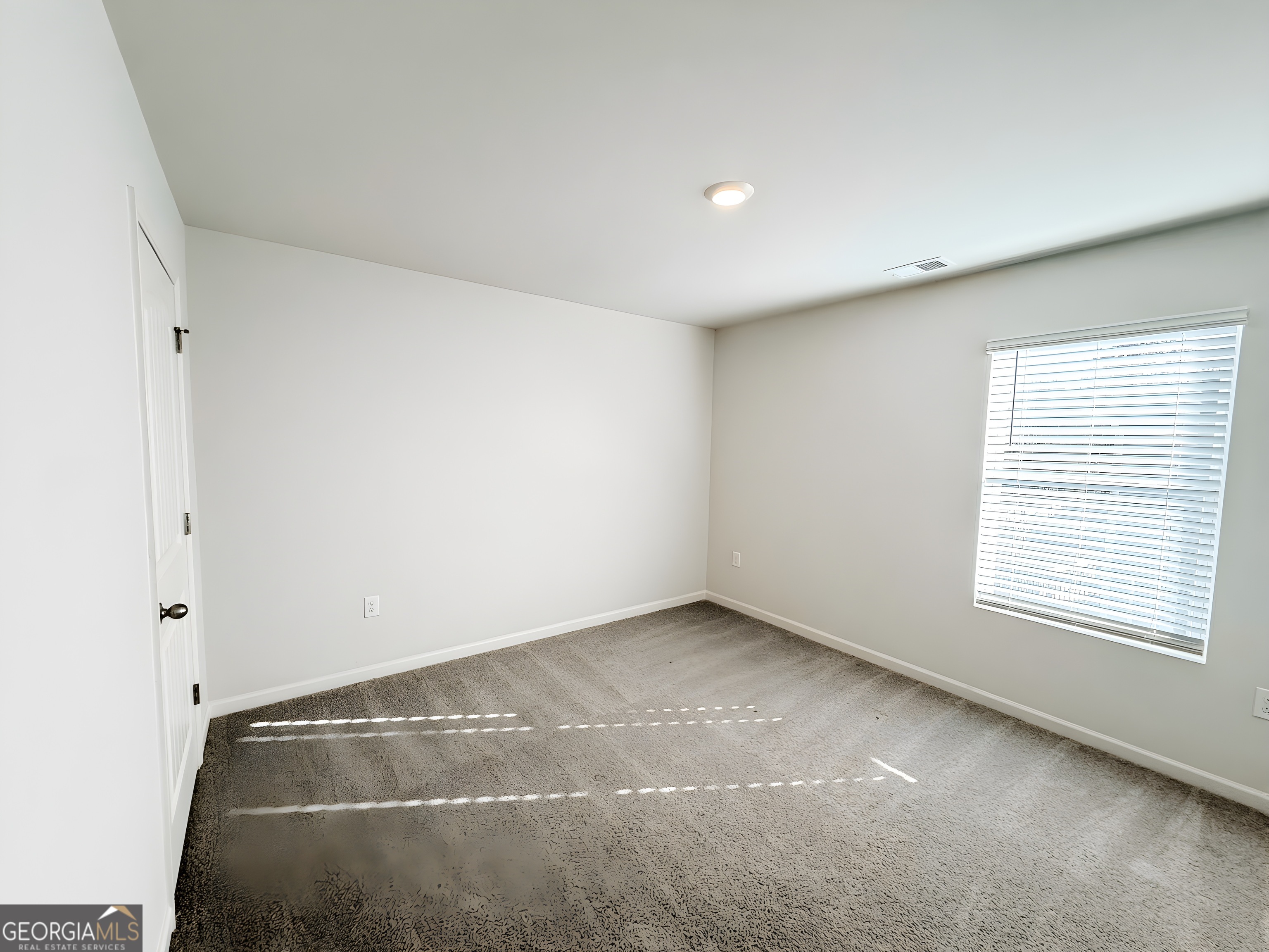 622 Brookfield Drive Braselton, GA 30517 - Photo 17 of 34 an empty room with a empty space and window