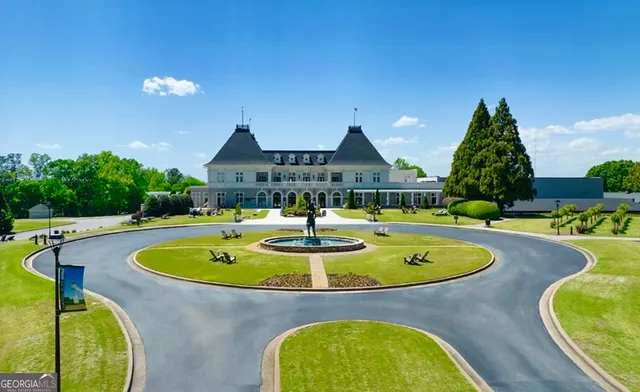 a view of swimming pool with outdoor seating and yard