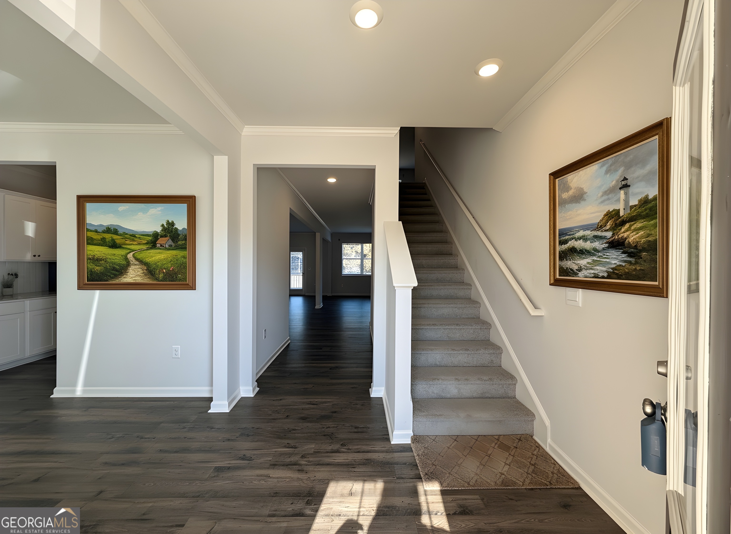 622 Brookfield Drive Braselton, GA 30517 - Photo 29 of 34 a view of a hallway with wooden floor and stairs