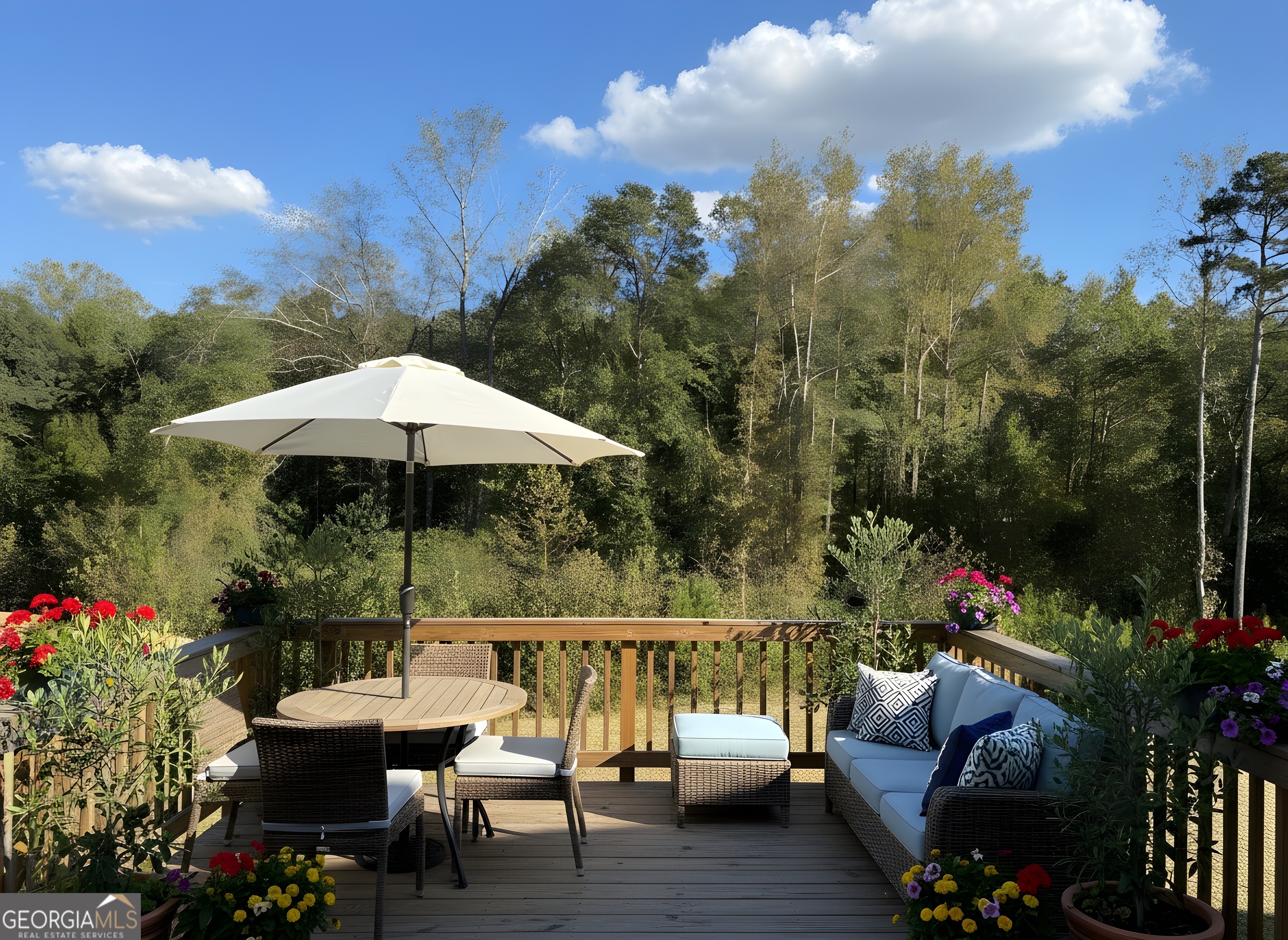 622 Brookfield Drive Braselton, GA 30517 - Photo 34 of 34 a view of a patio with couches under an umbrella