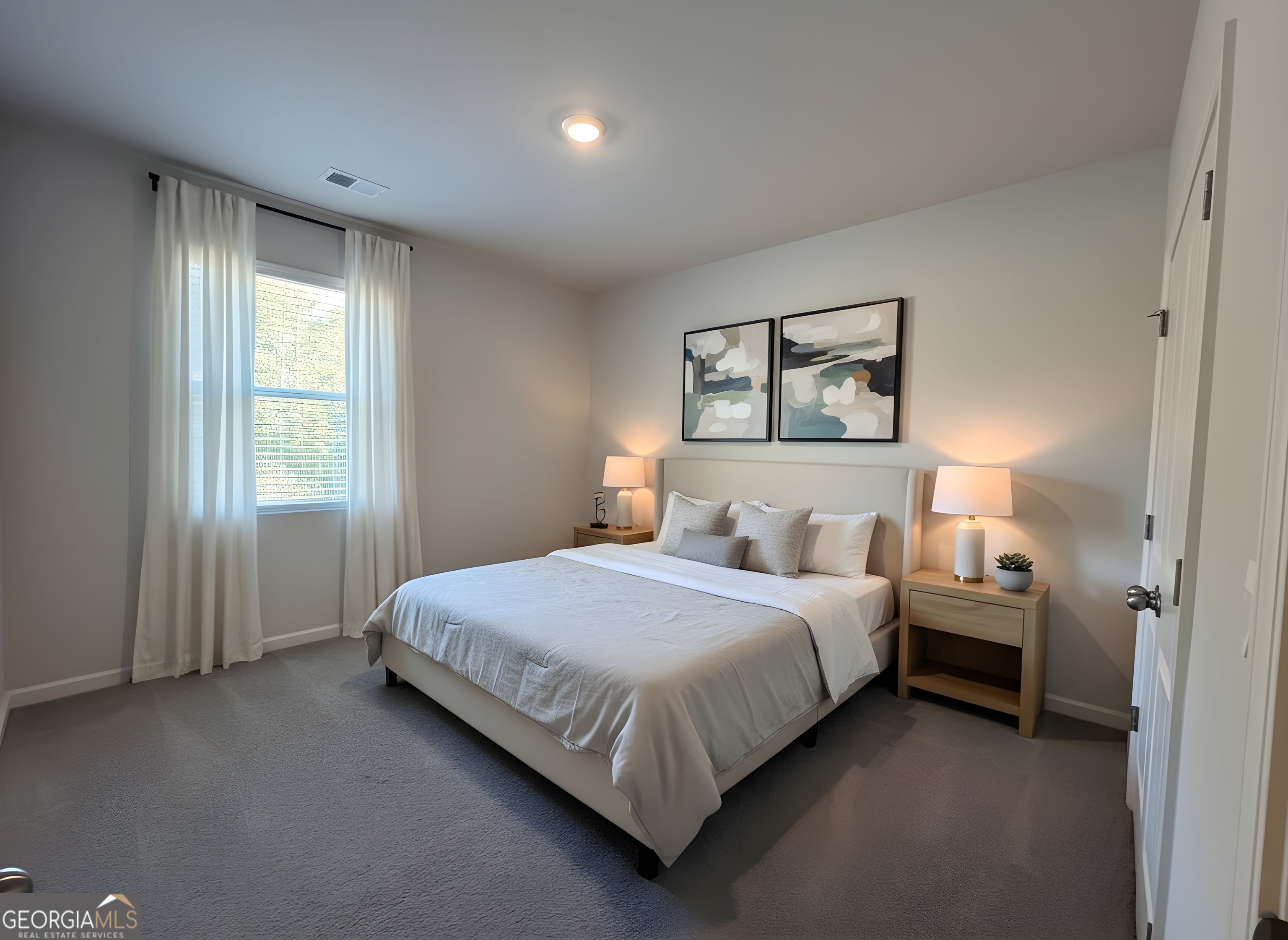 622 Brookfield Drive Braselton, GA 30517 - Photo 8 of 34 a bedroom with a bed and a window