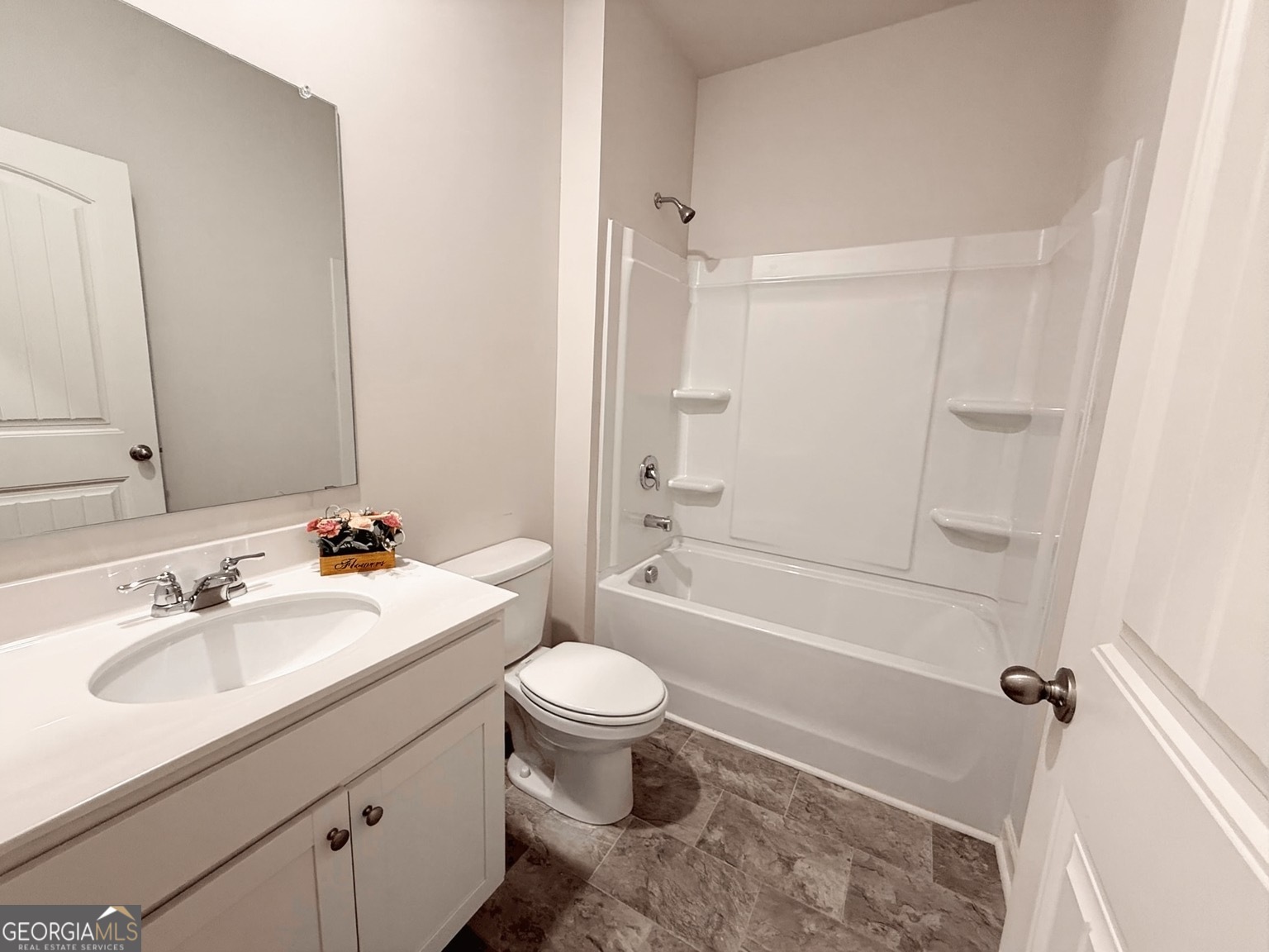 622 Brookfield Drive Braselton, GA 30517 - Photo 9 of 34 a bathroom with a sink toilet and shower