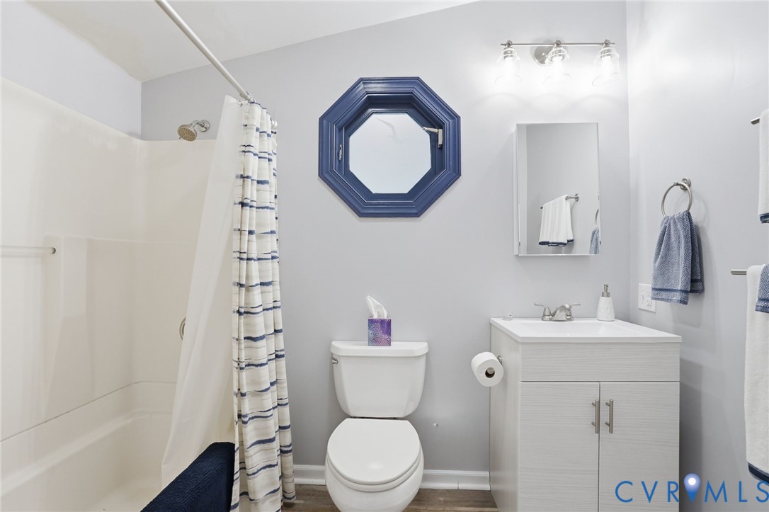247 Salisbury Park Road Hague, VA 22469 - Photo 21 of 44 a bathroom with a toilet a sink and a mirror