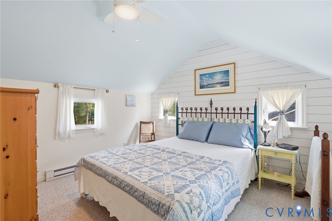 247 Salisbury Park Road Hague, VA 22469 - Photo 23 of 44 a bedroom with a bed and a table