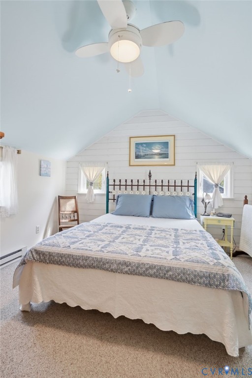 247 Salisbury Park Road Hague, VA 22469 - Photo 24 of 44 a bedroom with a bed and a chandelier