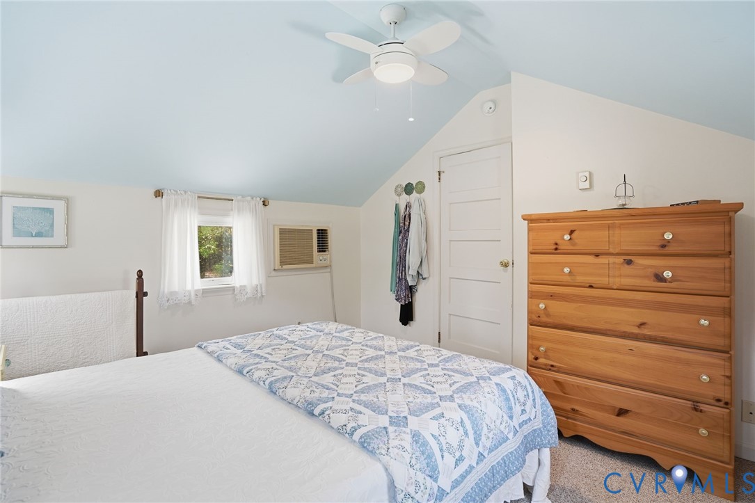 247 Salisbury Park Road Hague, VA 22469 - Photo 25 of 44 a bedroom with a bed and a dresser
