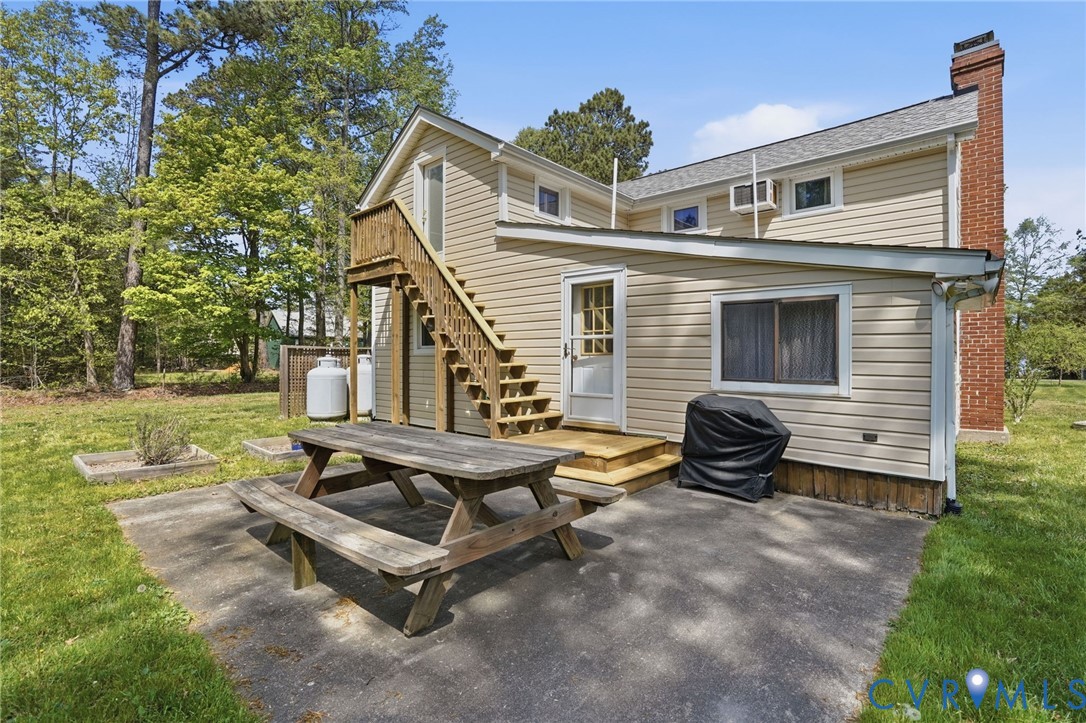 247 Salisbury Park Road Hague, VA 22469 - Photo 36 of 44 a view of a house with backyard and a tree