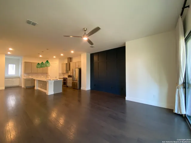 a view of a hallway with a kitchen