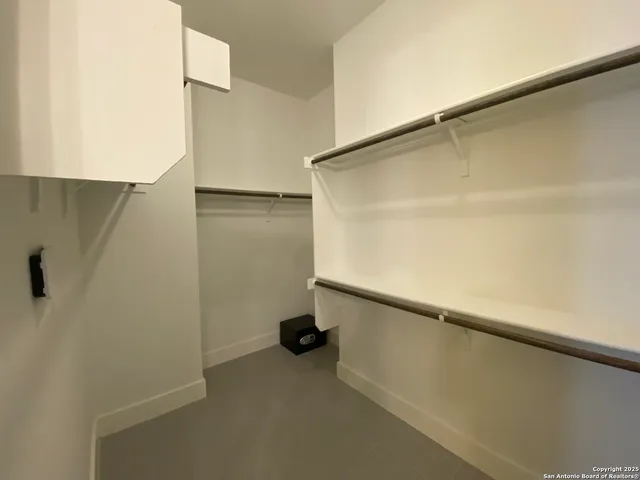 a view of a hallway with white walls