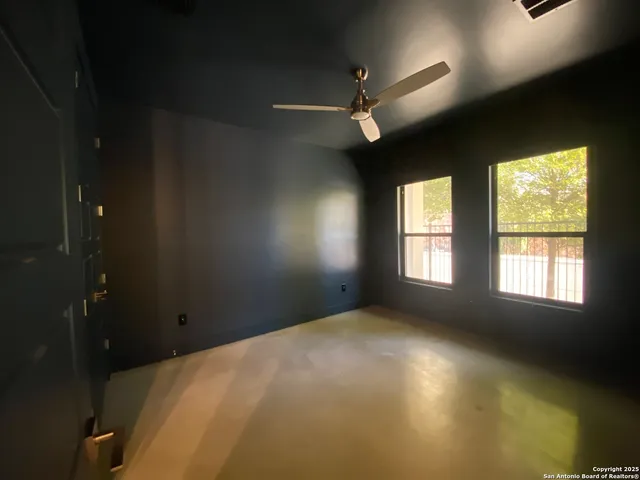 a view of empty room with windows