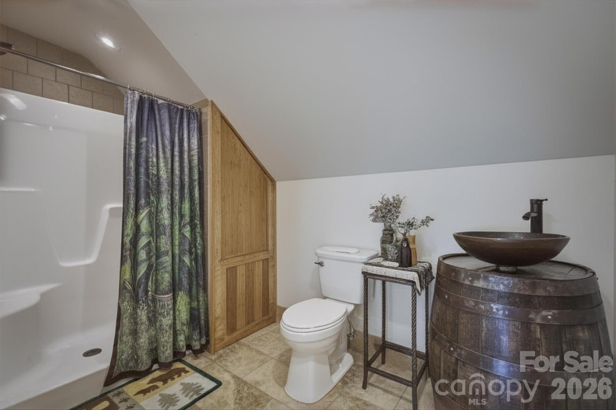 7490 Oak Ridge Church Road Connelly Springs, NC 28612 - Photo 31 of 44 a bathroom with a toilet a sink and shower