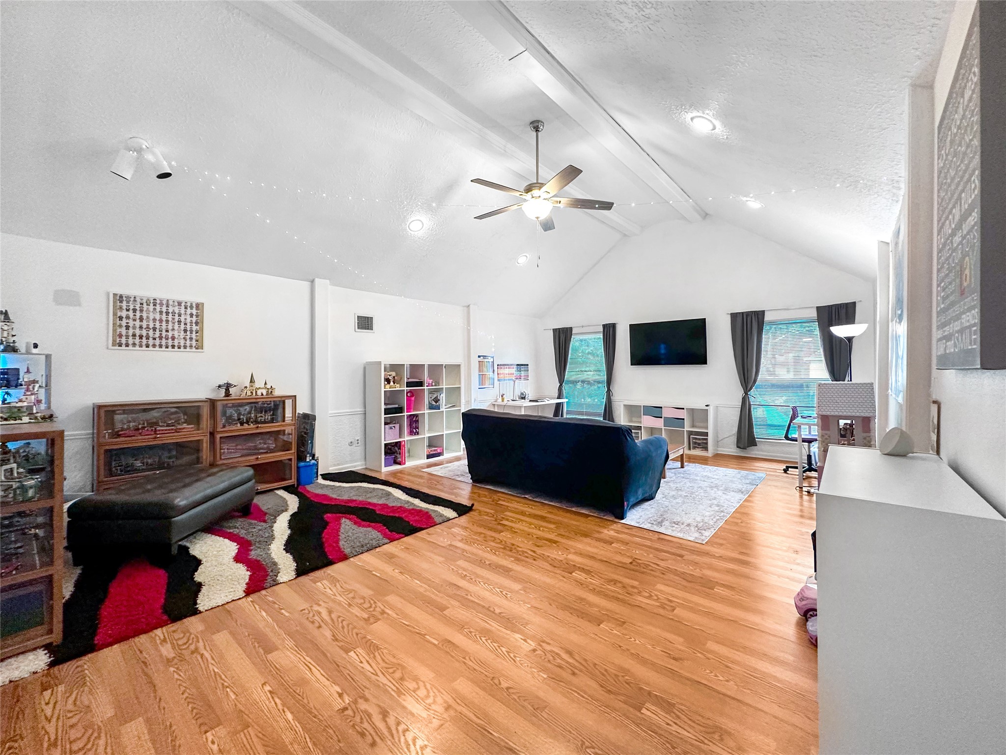 6511 Castle Pine Lane Spring, TX 77379 - Photo 29 of 49 Bright and versatile upstairs game room offering excellent flexibility for a media space, playroom, lounge area, or home entertainment setup with an open-concept feel.