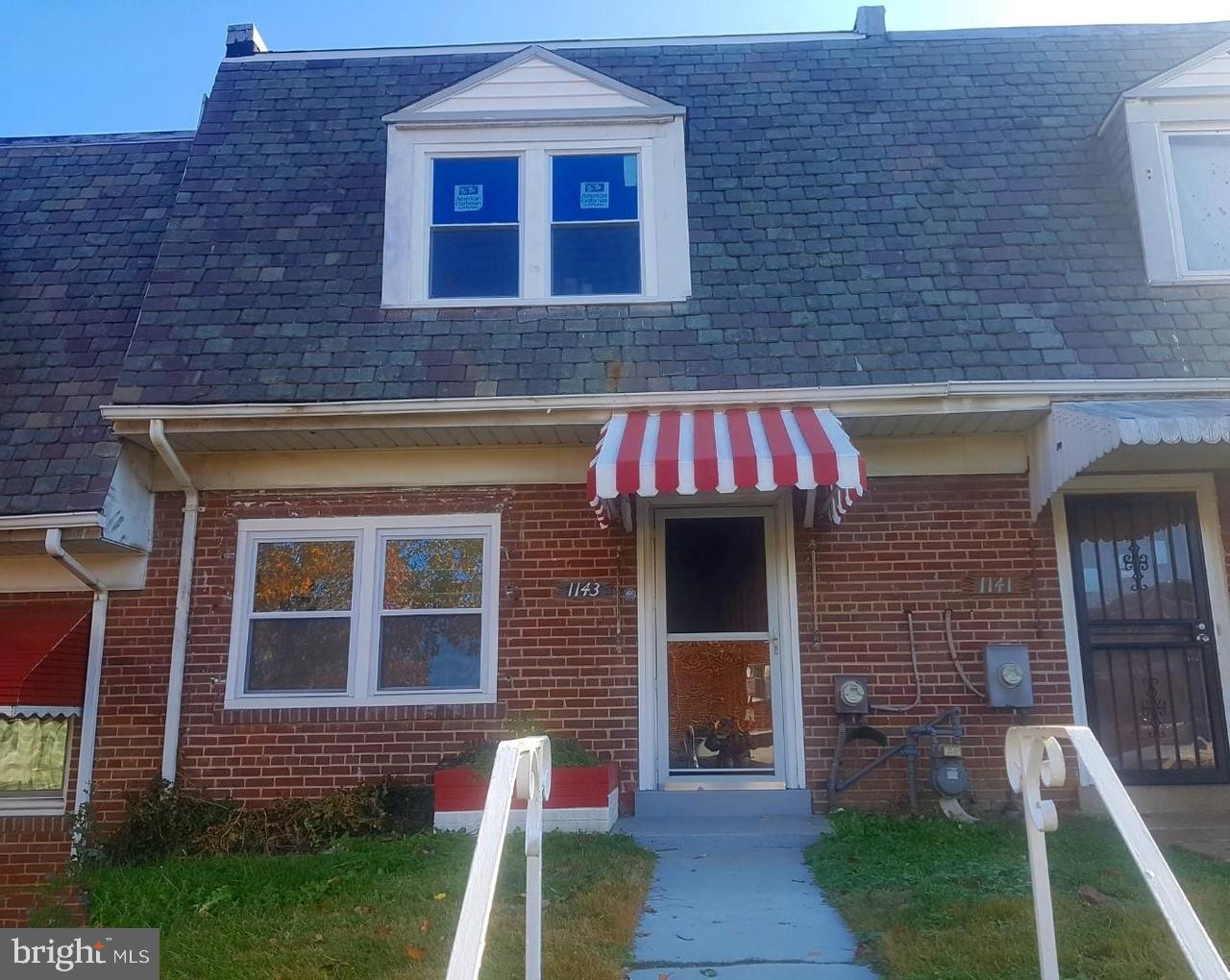 1143 19th Street Northeast Washington, DC 20002 - Photo 2 of 13 a front view of a house with a yard