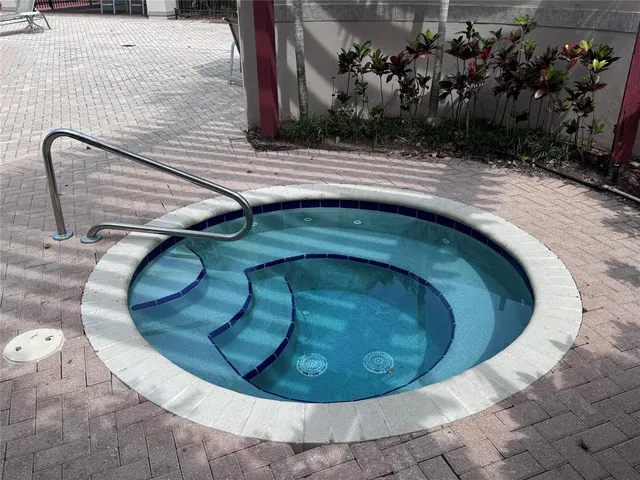 a view of a swimming pool with a patio