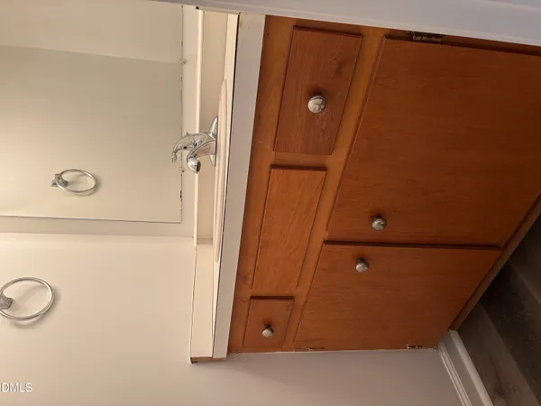 a view of a hallway with a window