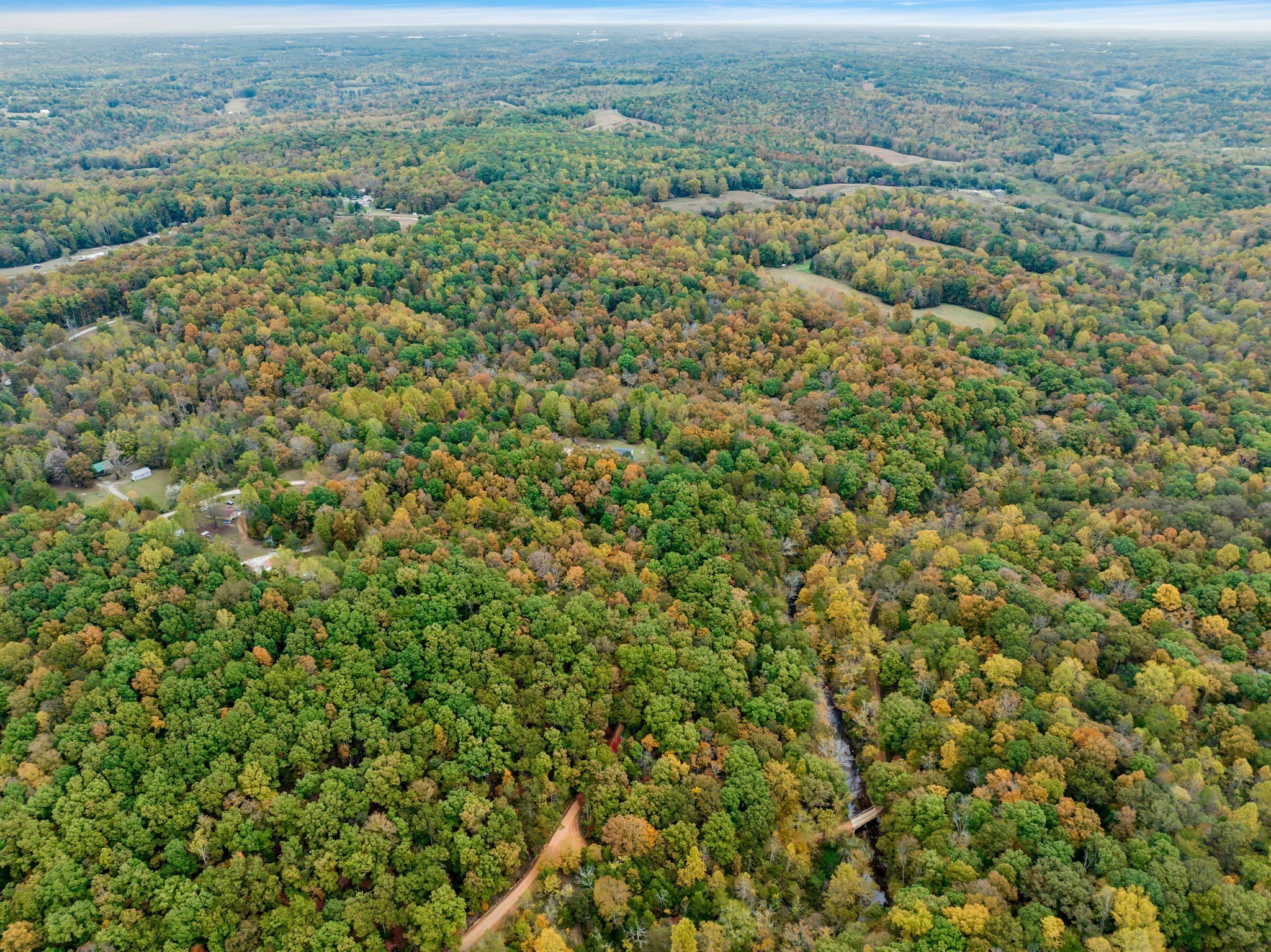 0 Bear Creek Road Bon Aqua, TN 37025 - Photo 34 of 64 an aerial view of residential houses with outdoor space and trees