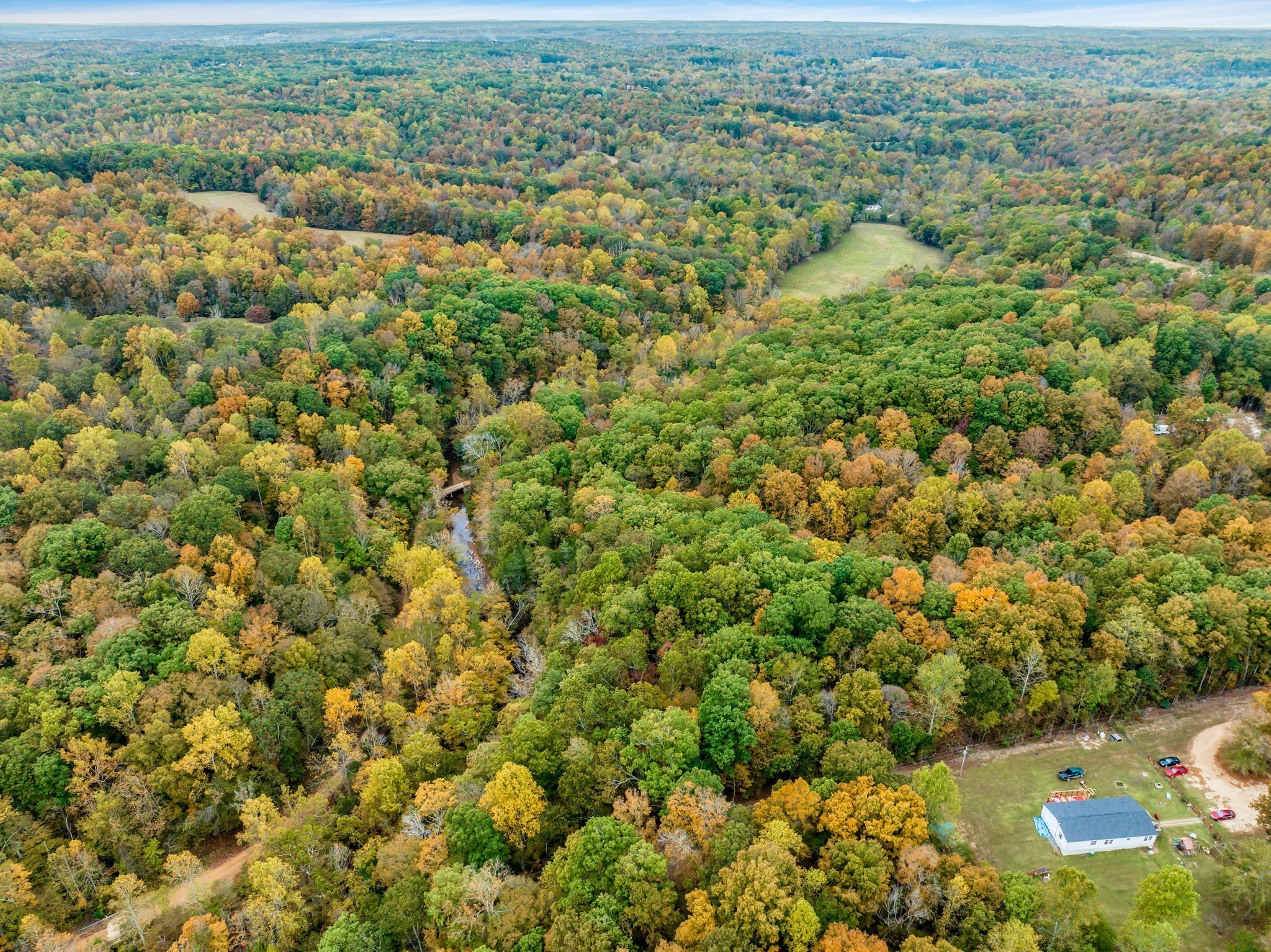 0 Bear Creek Road Bon Aqua, TN 37025 - Photo 43 of 64 an aerial view of residential houses with outdoor space and trees