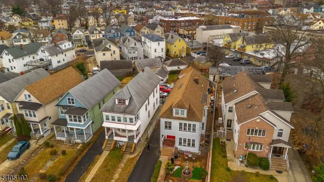 an aerial view of a residential apartment building with a yard