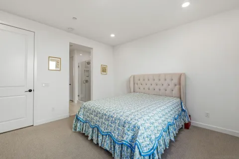 a bedroom with a bed and a walk in closet