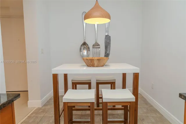 a bedroom with a bed and glass door