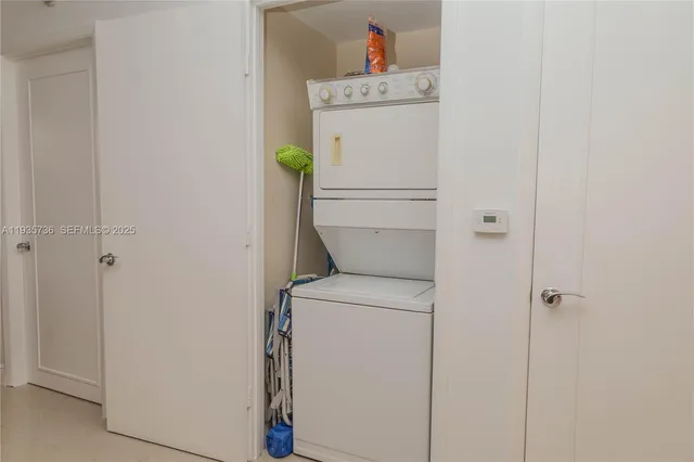 a bedroom with a large bed and a large window