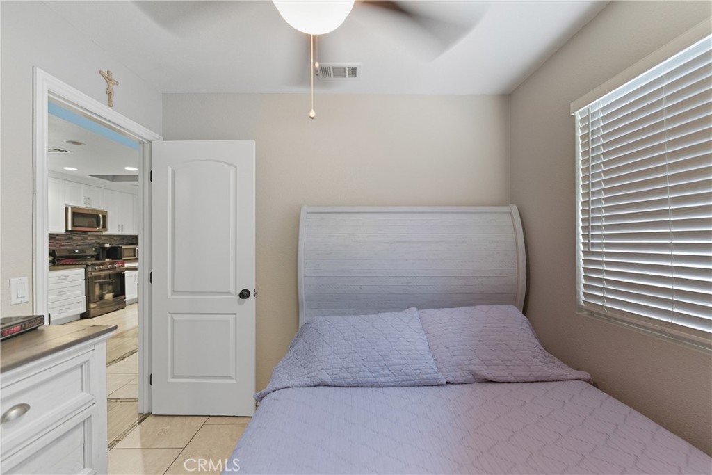24150 Rothbury Drive Moreno Valley, CA 92553 - Photo 12 of 26 a bathroom with a sink and mirror