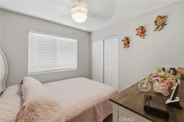 a bedroom with a bed and a table in it