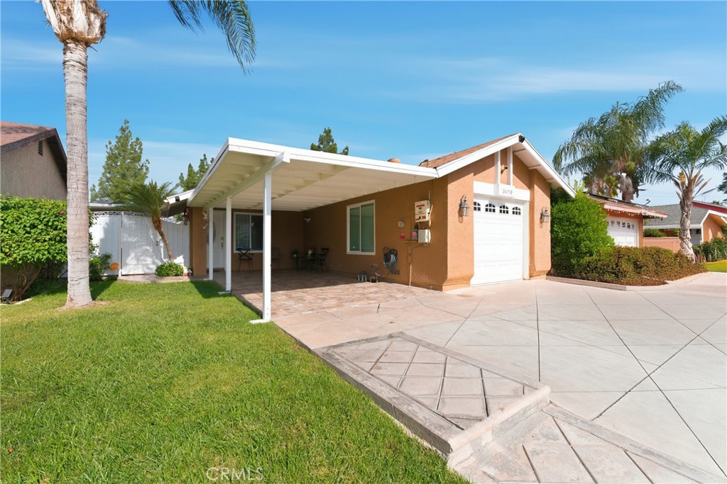 24150 Rothbury Drive Moreno Valley, CA 92553 - Photo 2 of 26 a view of a house with backyard and porch