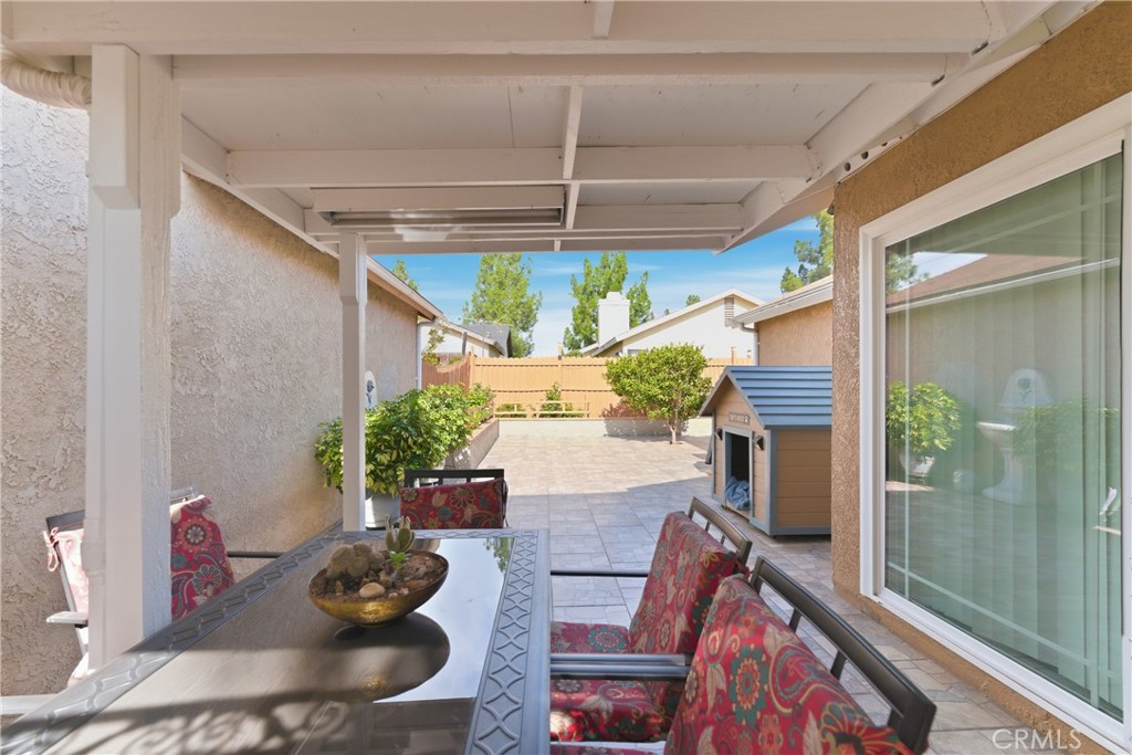 24150 Rothbury Drive Moreno Valley, CA 92553 - Photo 21 of 26 a living room with furniture and a potted plant