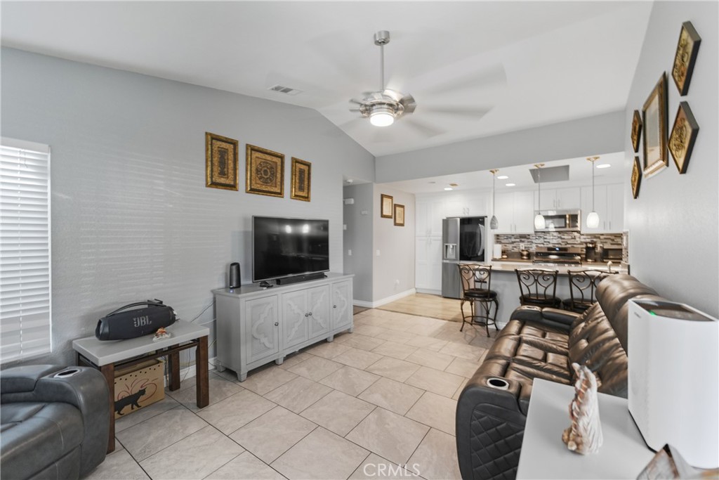24150 Rothbury Drive Moreno Valley, CA 92553 - Photo 4 of 26 a living room with furniture and a flat screen tv