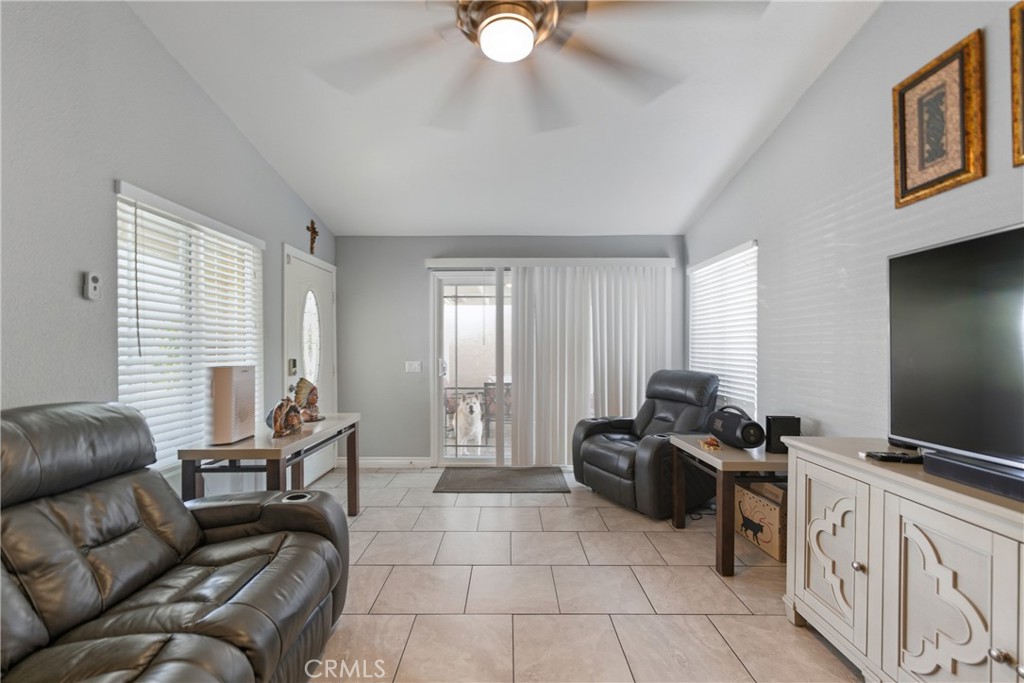 24150 Rothbury Drive Moreno Valley, CA 92553 - Photo 6 of 26 a living room with furniture and a flat screen tv