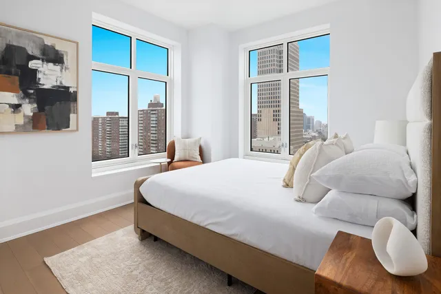 a bedroom with bed and window