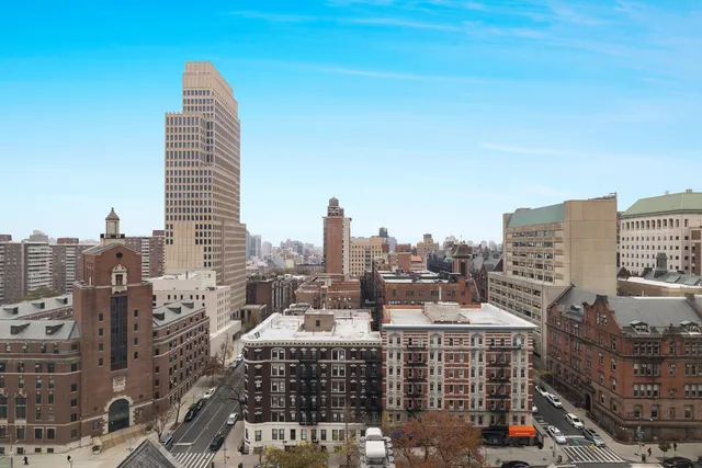 a view of a city with tall buildings