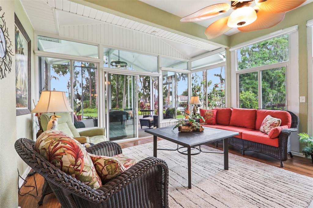 2512 Baywater Road Tavares, FL 32778 - Photo 11 of 75 a living room with furniture and a floor to ceiling window