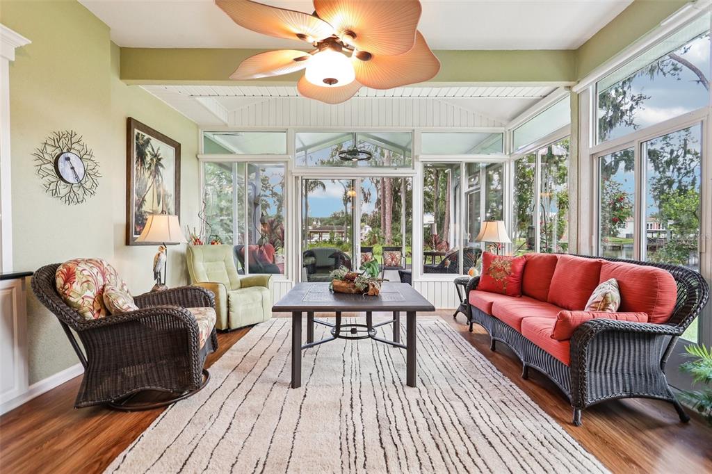 2512 Baywater Road Tavares, FL 32778 - Photo 12 of 75 a living room with furniture a table and chairs