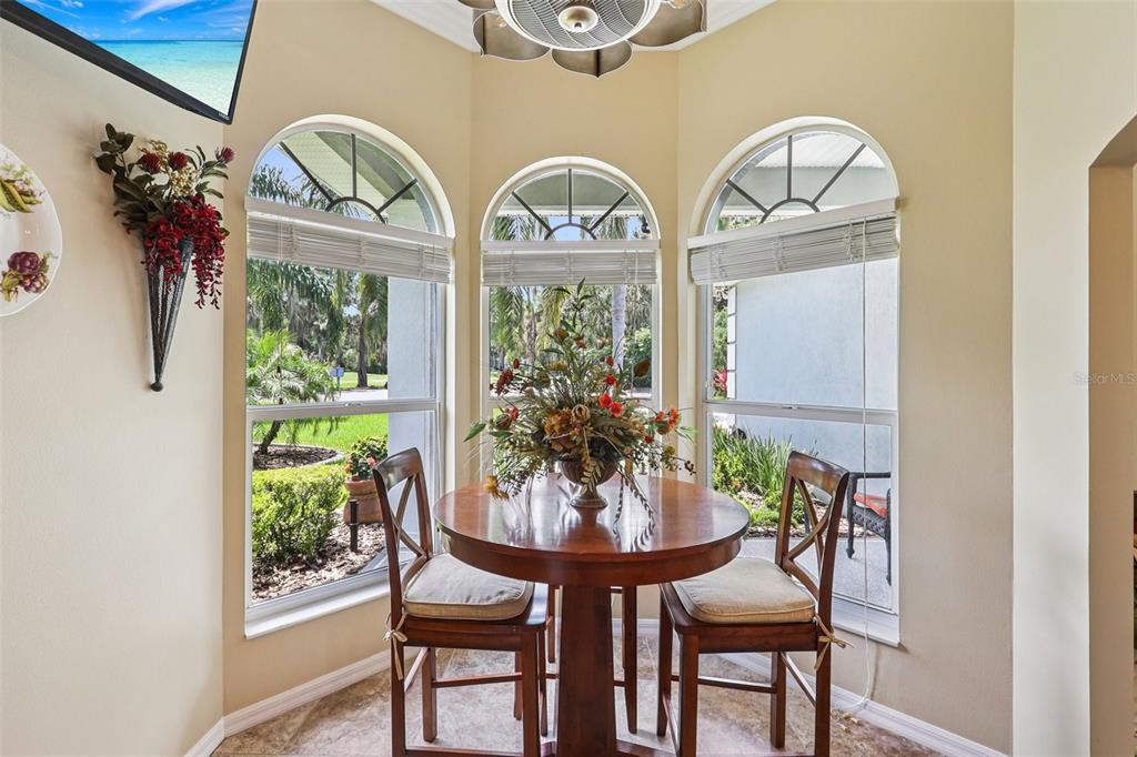 2512 Baywater Road Tavares, FL 32778 - Photo 19 of 75 a view of a dining room with furniture and a large window