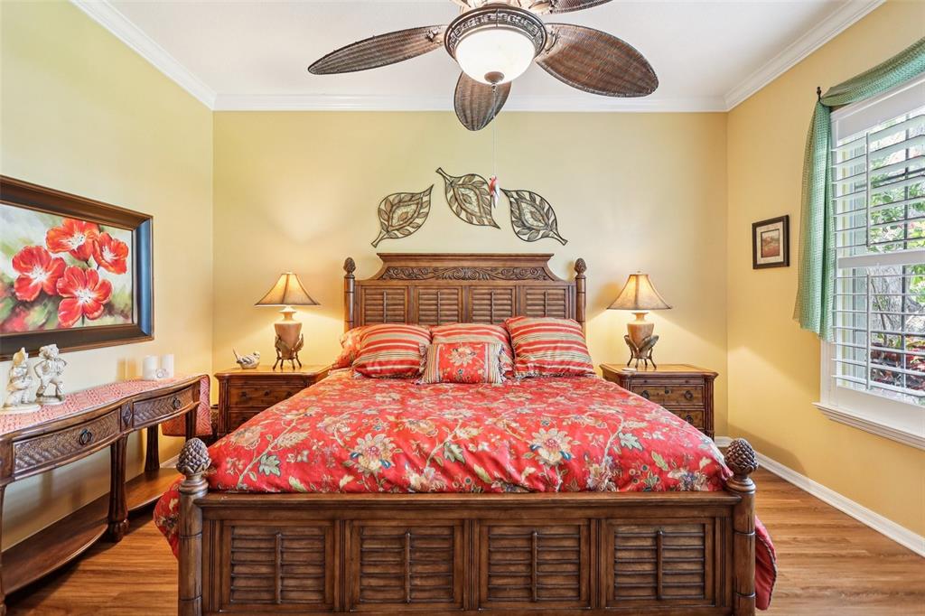 2512 Baywater Road Tavares, FL 32778 - Photo 26 of 75 a bed sitting in a bedroom next to a window