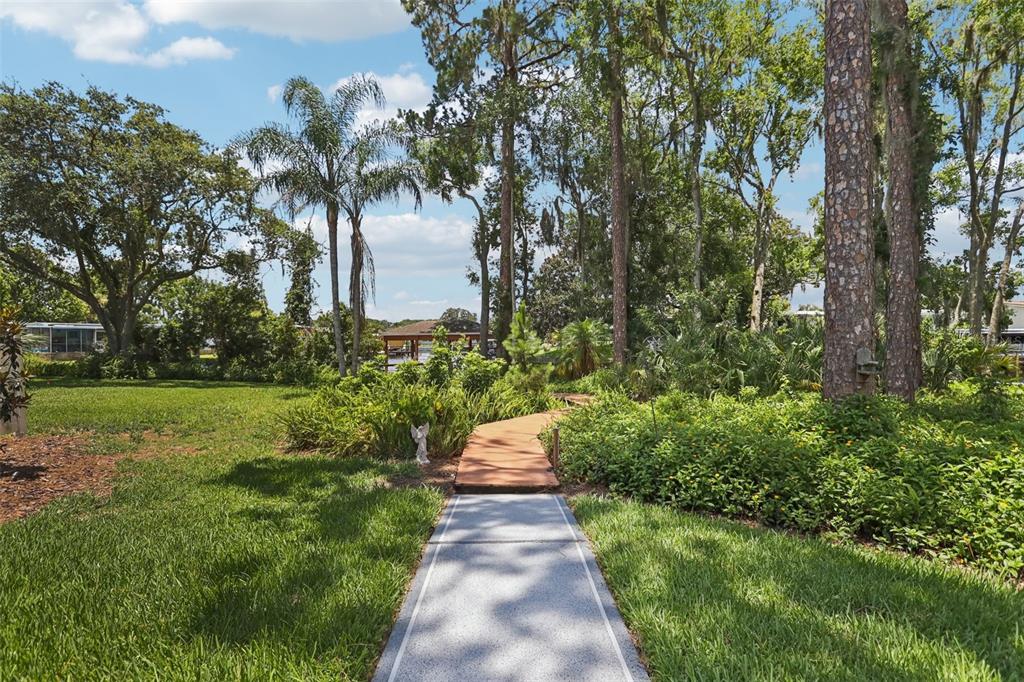 2512 Baywater Road Tavares, FL 32778 - Photo 38 of 75 a view of a pathway both side of yard