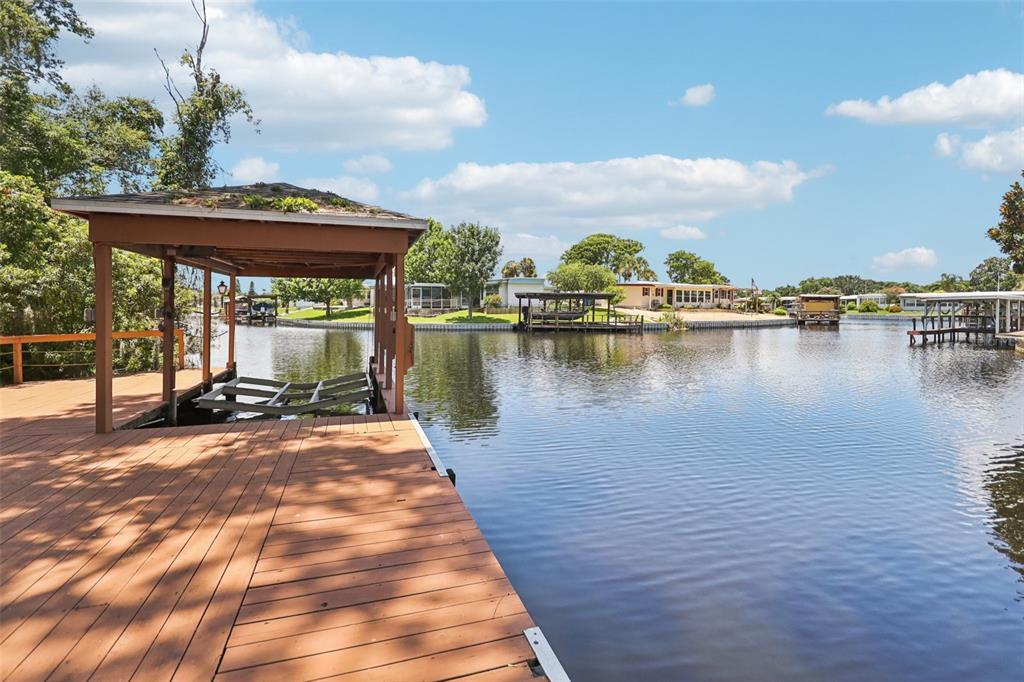 2512 Baywater Road Tavares, FL 32778 - Photo 46 of 75 a view of a lake with a terrace