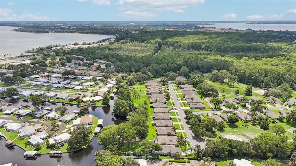 2512 Baywater Road Tavares, FL 32778 - Photo 50 of 75 an aerial view of residential houses with outdoor space and trees