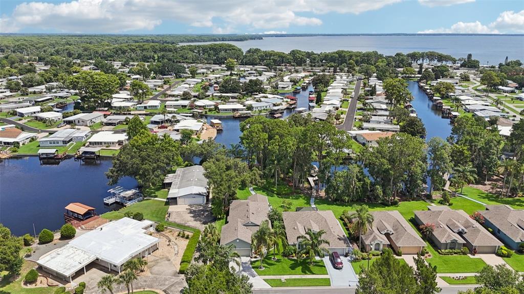 2512 Baywater Road Tavares, FL 32778 - Photo 68 of 75 an aerial view of residential houses with outdoor space and trees all around