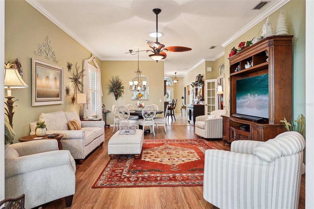 2512 Baywater Road Tavares, FL 32778 - Photo 7 of 75 a living room with furniture a rug and a flat screen tv